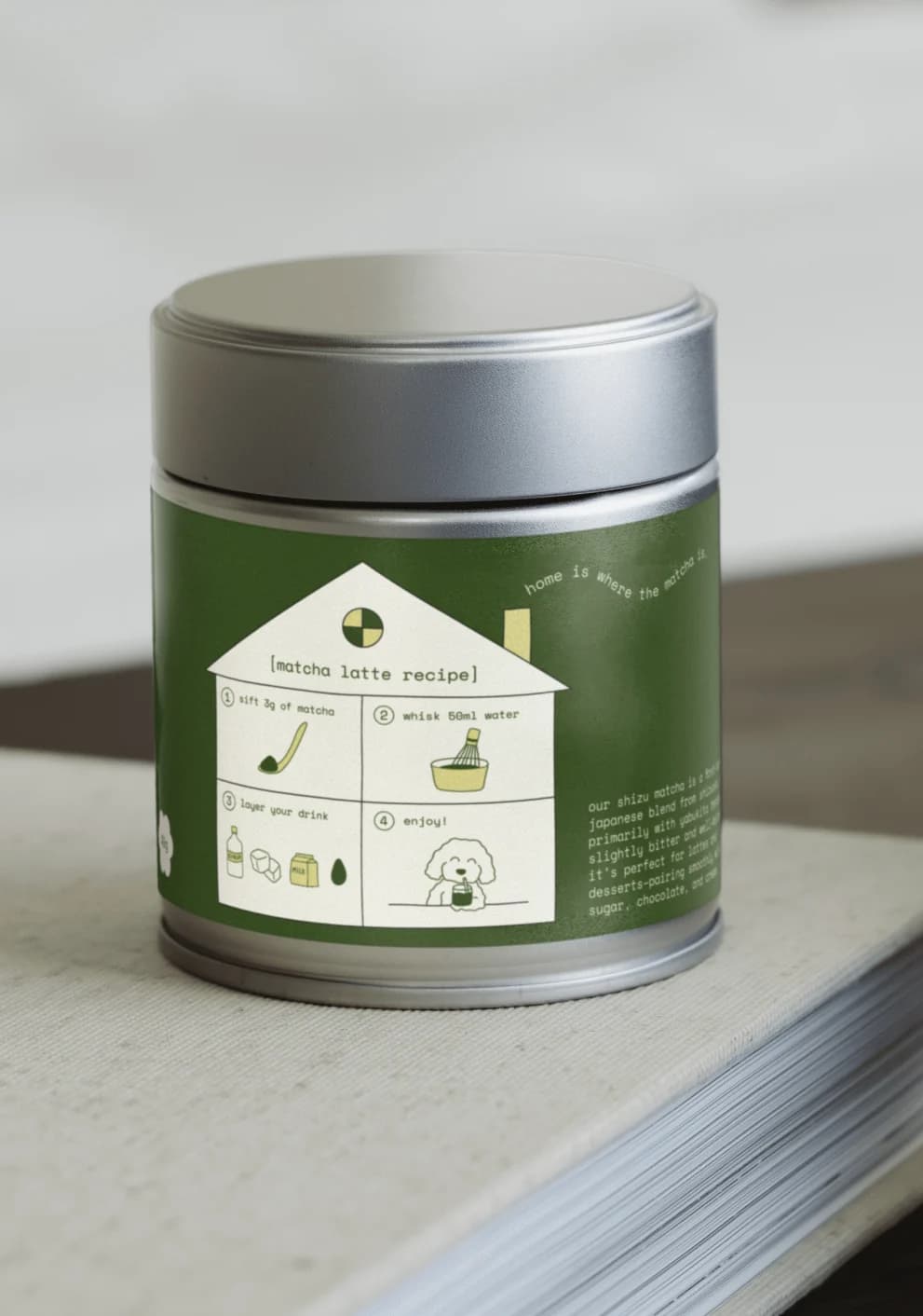 Back of the Mitchie Matcha tin, with a house-shaped label showing brewing instructions